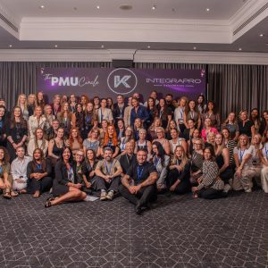 A large group of attendees photographed together at Queen's Night 2026.