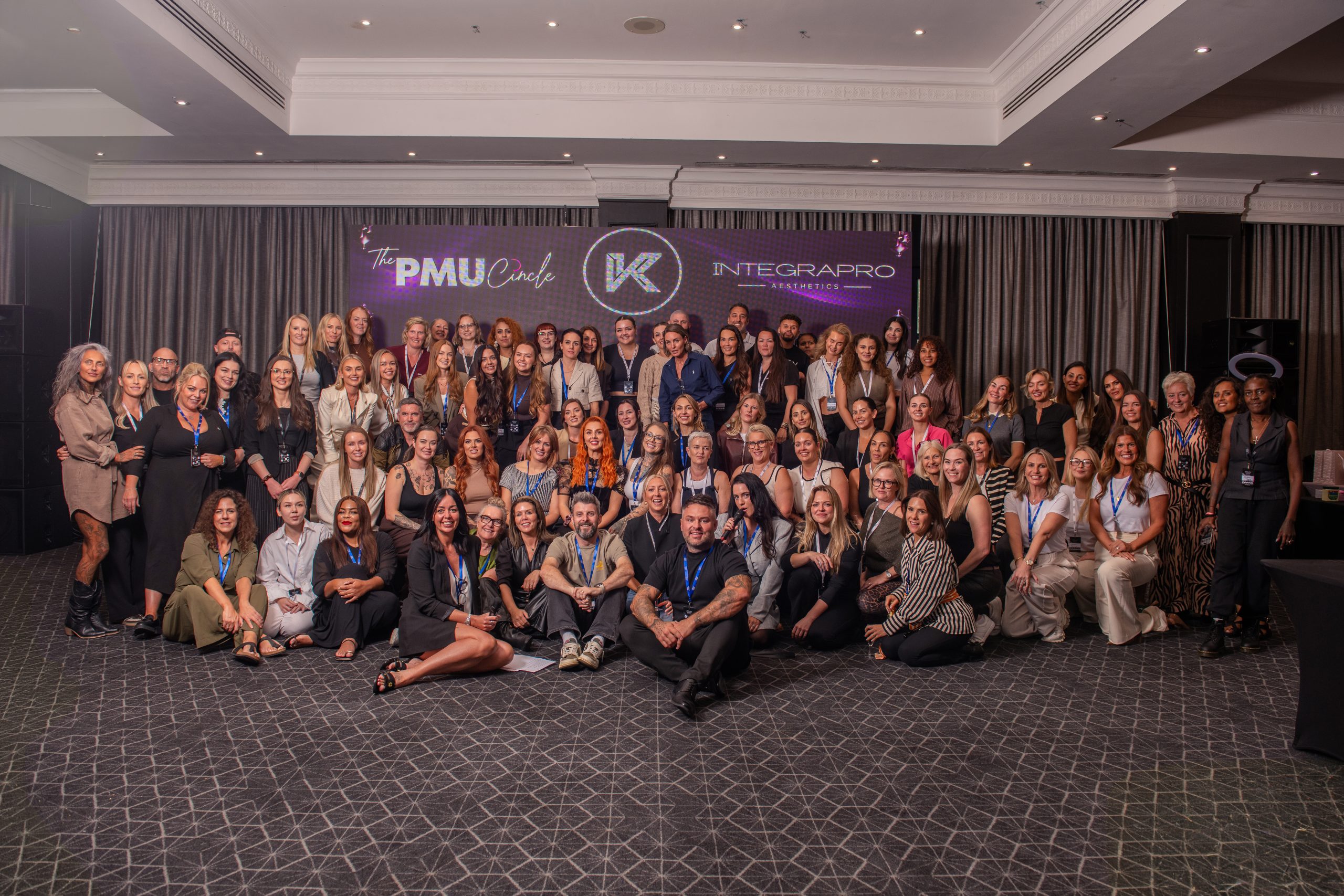A large group of attendees photographed together at Queen's Night 2026.